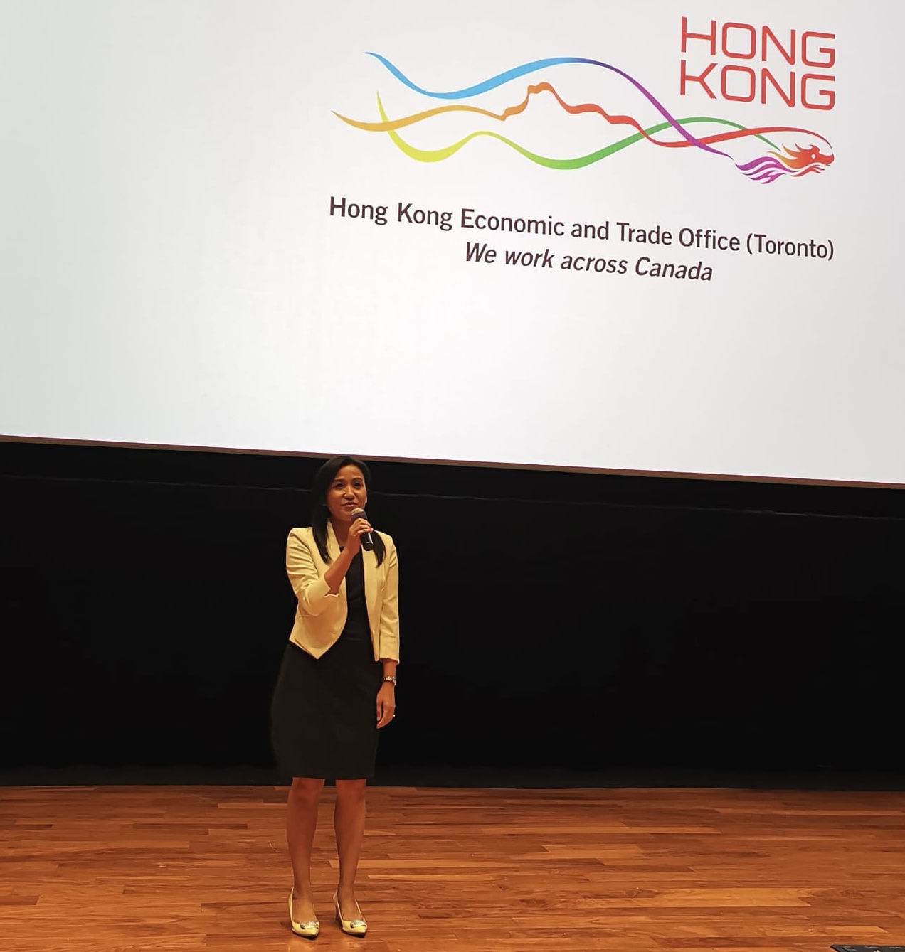 Director of the Hong Kong Economic and Trade Office (Toronto) (HKETO), Ms Emily Mo, speaks before the screening of Hong Kong film “Keep Rolling” at the Innis Town Hall on August 12.