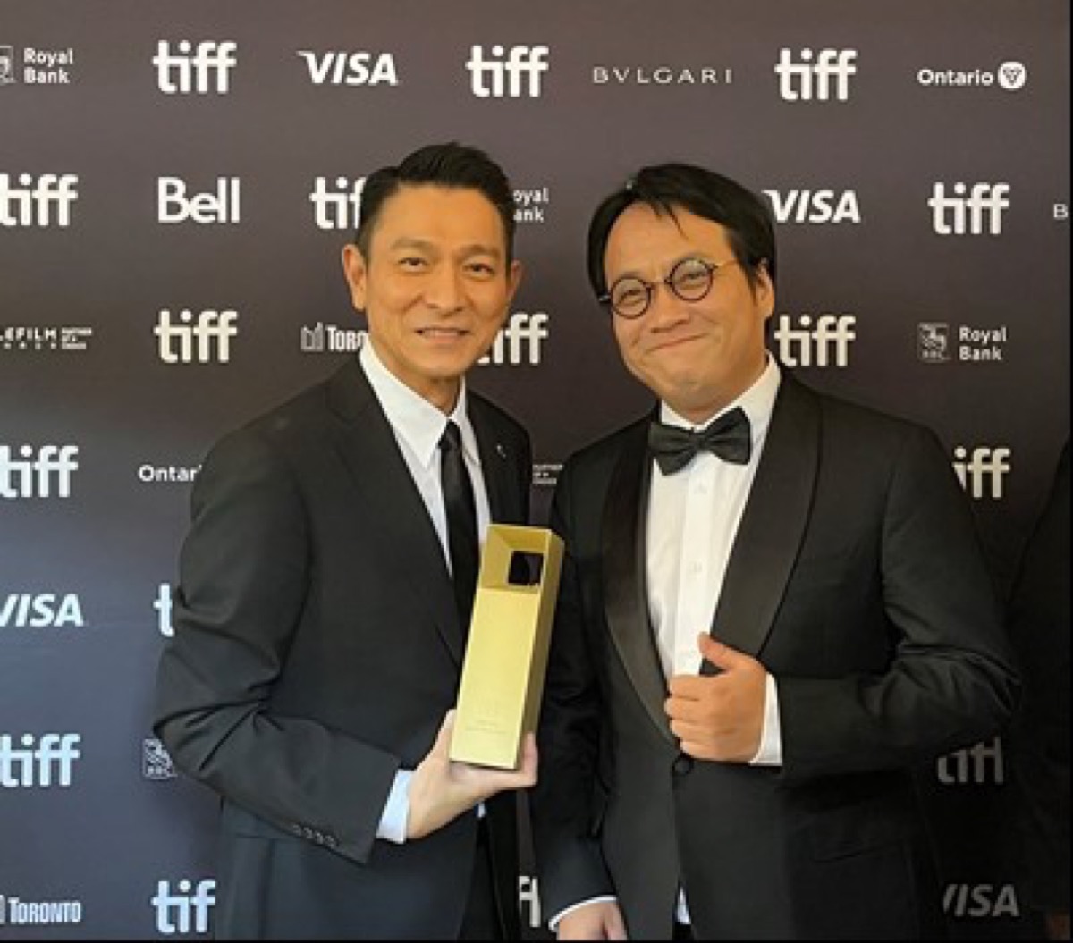 Hong Kong artist Andy Lau shared the joy with Ning Hao, Director of “The Movie Emperor”, at Toronto International Film Festival 2023.
