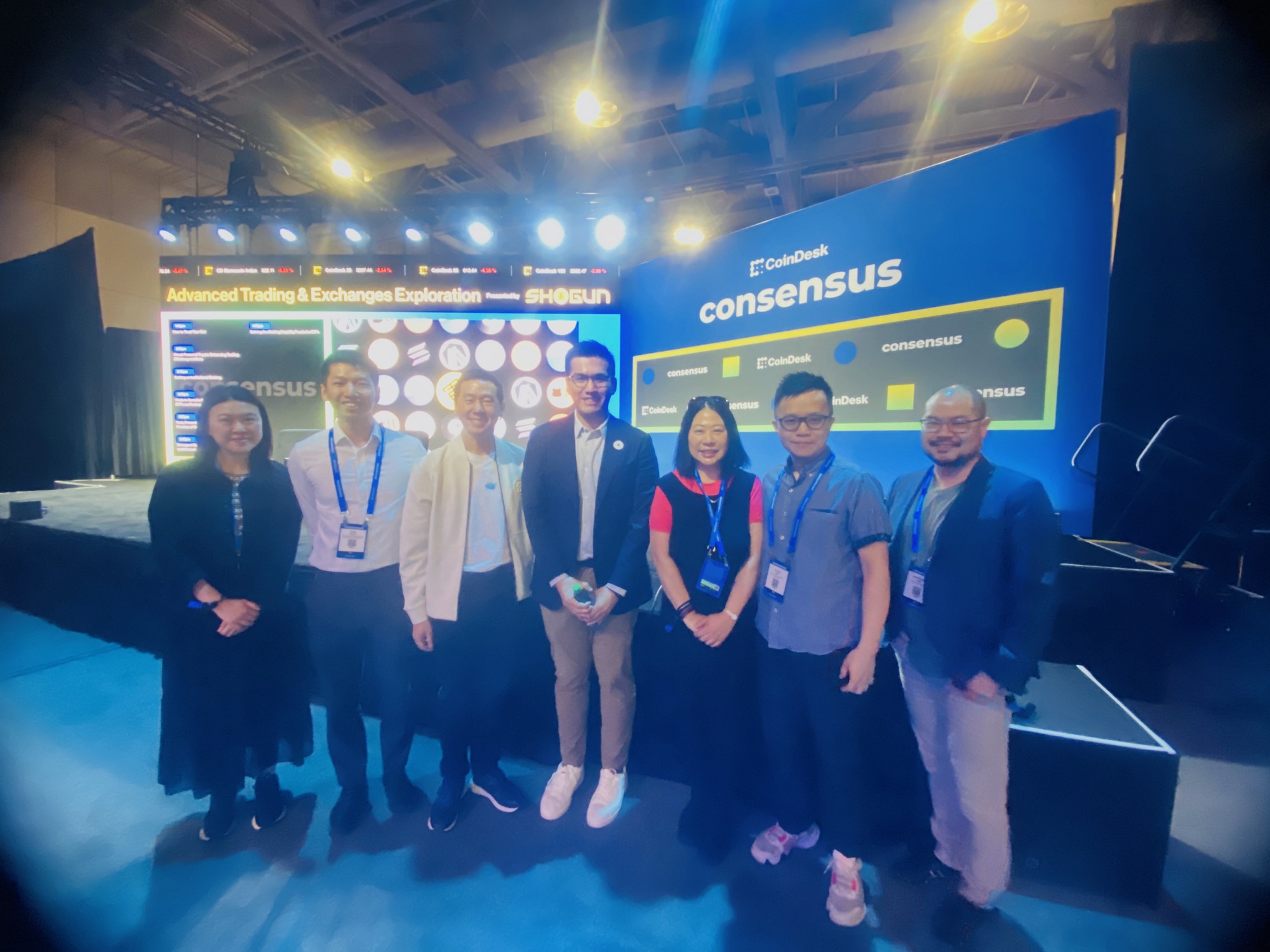 The Acting Director of the Hong Kong Economic and Trade Office (Toronto), Mr Gavin Yeung (second left), posed for a group photo with the Group President of Animoca Brands, Mr Evan Auyang (third left); Chief Representative (New York & London Office) of Hong Kong Monetary Authority, Mr Anson Law (second right); Head of Investment Promotion of Invest Honbg Kong (InvestHK), Mr Christopher Chen (first right); Deputy Head of Investment Promotion of InvestHK, Ms Grace Lau (third right), and other distinguished speakers at a seminar of the Consensus 2025 on May 15.